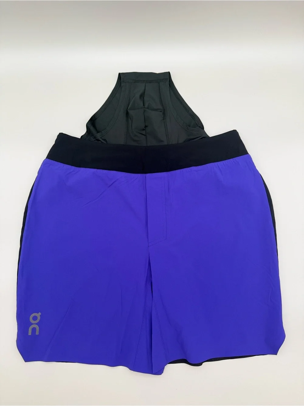 On Running Black Waistband blue and black Men Running Shorts size men’s Medium.